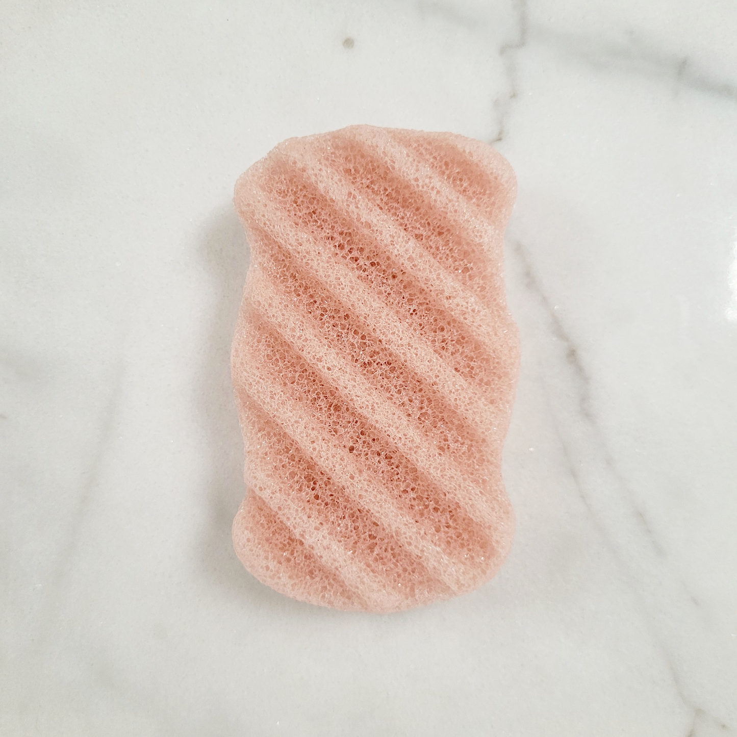 Caley-Beth sustainable skin and body care Toronto, Ontario Canada.   Eco-friendly Konjac Body & Face Sponge in four colours; Black bamboo charcoal, White natural, Light pink cherry blossom, and Pink/Red French Red clay.