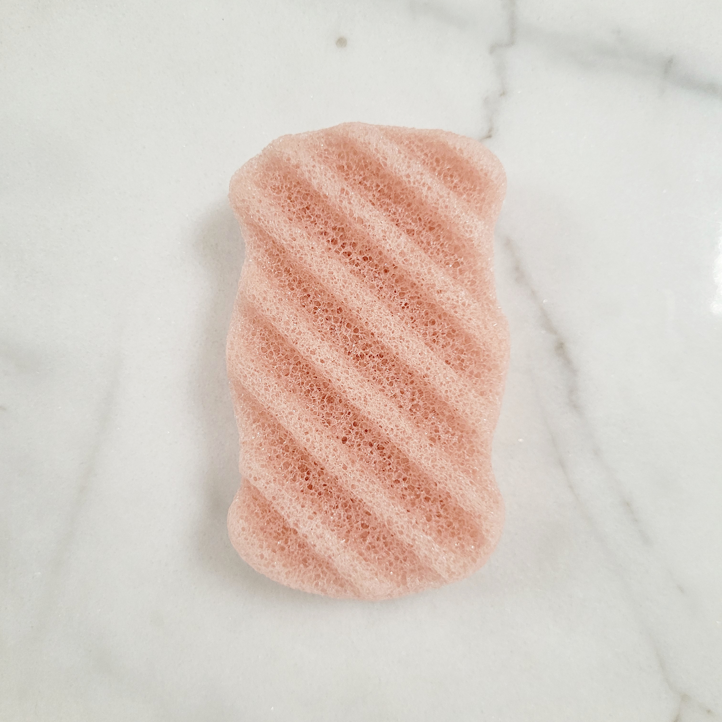 A flat lay of each Konjac Sponge in Cherry blossom pink color, showcasing variety in natural, eco-friendly exfoliating sponges