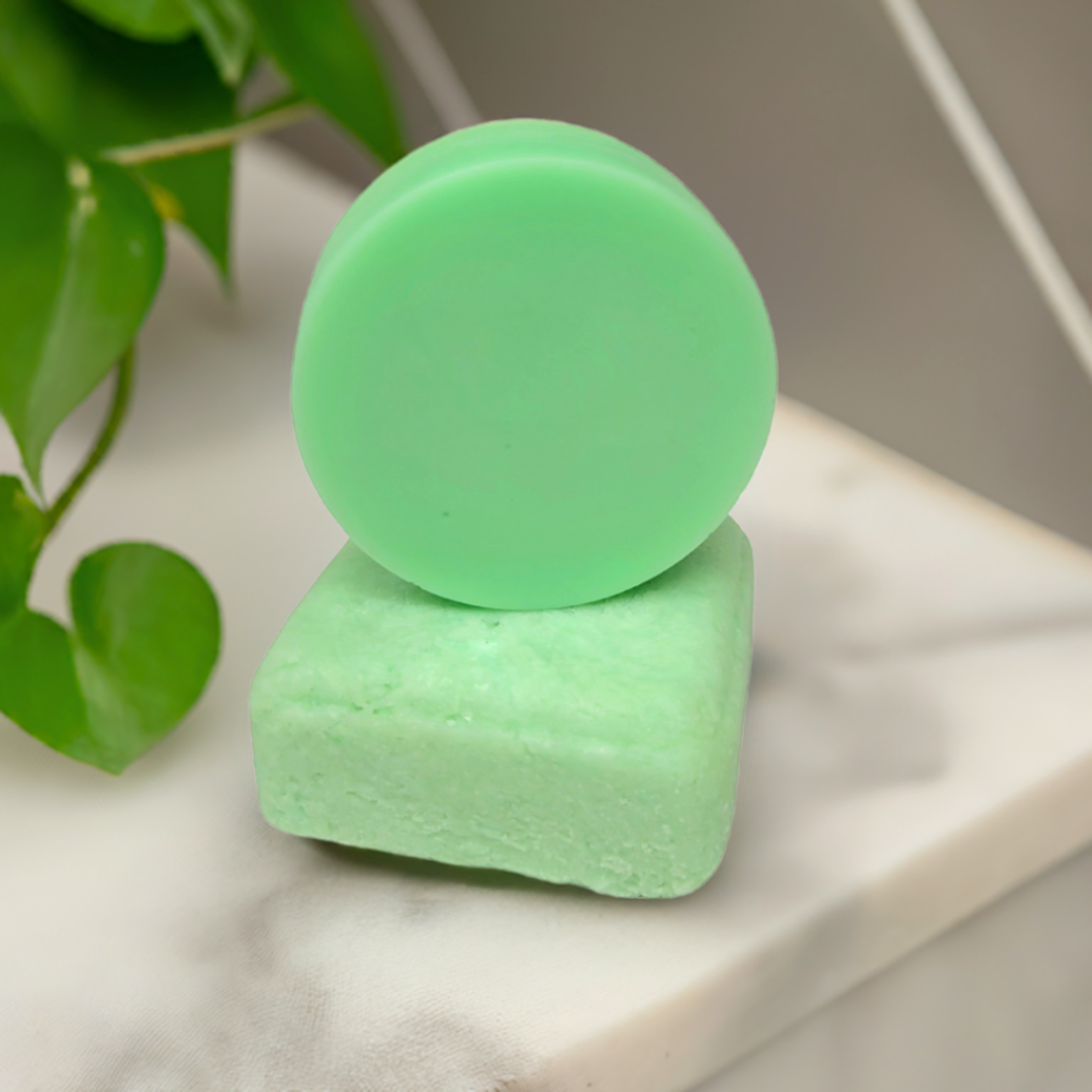 Stacked rosemary and mint shampoo and conditioner bars made in Canada, eco-friendly hair care with a refreshing herbal scent.