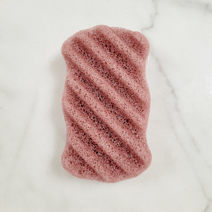 A flat lay of each Konjac Sponge in French Red clay color, showcasing variety in natural, eco-friendly exfoliating sponges.