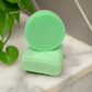 Stacked rosemary and mint shampoo and conditioner bars made in Canada, eco-friendly hair care with a refreshing herbal scent.