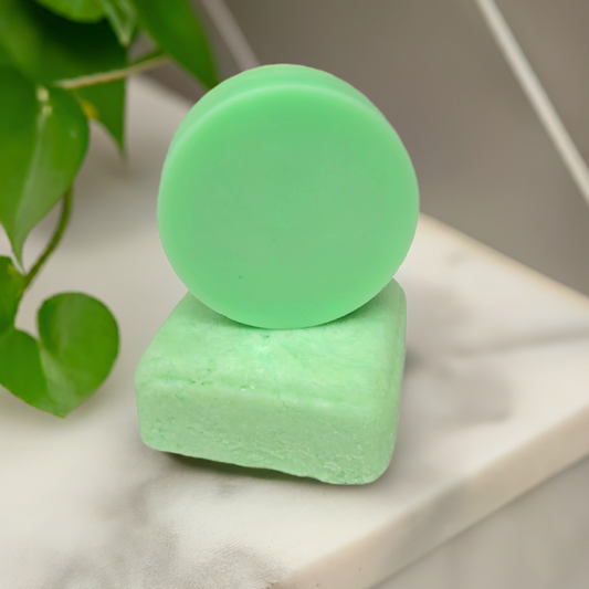 Stacked rosemary and mint shampoo and conditioner bars made in Canada, eco-friendly hair care with a refreshing herbal scent.
