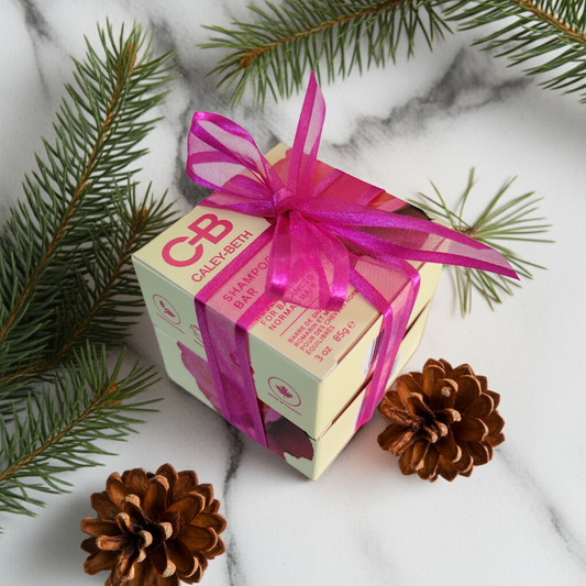 Holiday gift-ready Soft & Shiny Hair Bundle in Rosemary & Mint, wrapped with a bow, including Shampoo Bar and Conditioner Bar for soft, nourished, shiny hair.