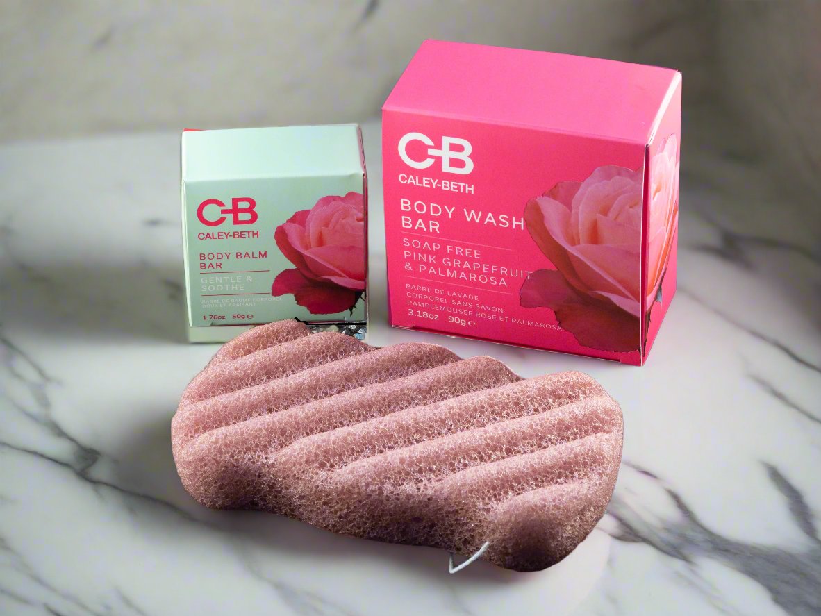 All three products of the Soft Skin Set laid out: Body Balm Bar, Soap-Free Body Wash Bar, and Konjac Sponge. Made in Canada with clean ingredients.