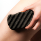 A woman holding a large Konjac Sponge, ideal for full-body cleansing and delicate facial exfoliation. 