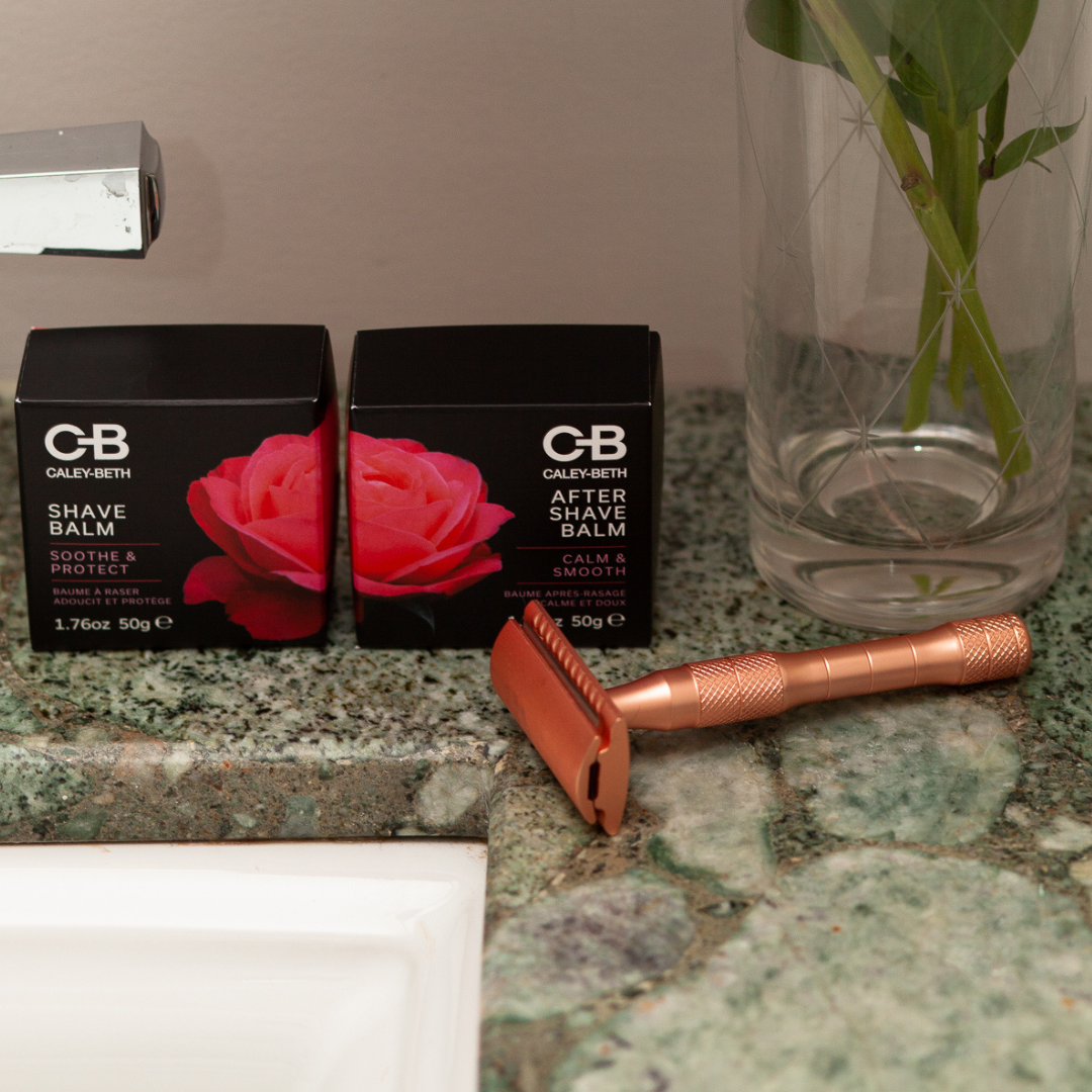  A rose gold safety razor next to Caley-Beth Shave Balm & After Shave Balm, the perfect set for a gentle, irritation-free shave.