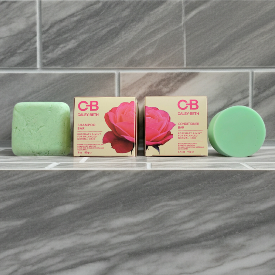 Caley Beth Shampoo and Conditioner Bars made in Canada, sitting on a shower shelf, natural zero-waste hair care for soft, healthy hair.