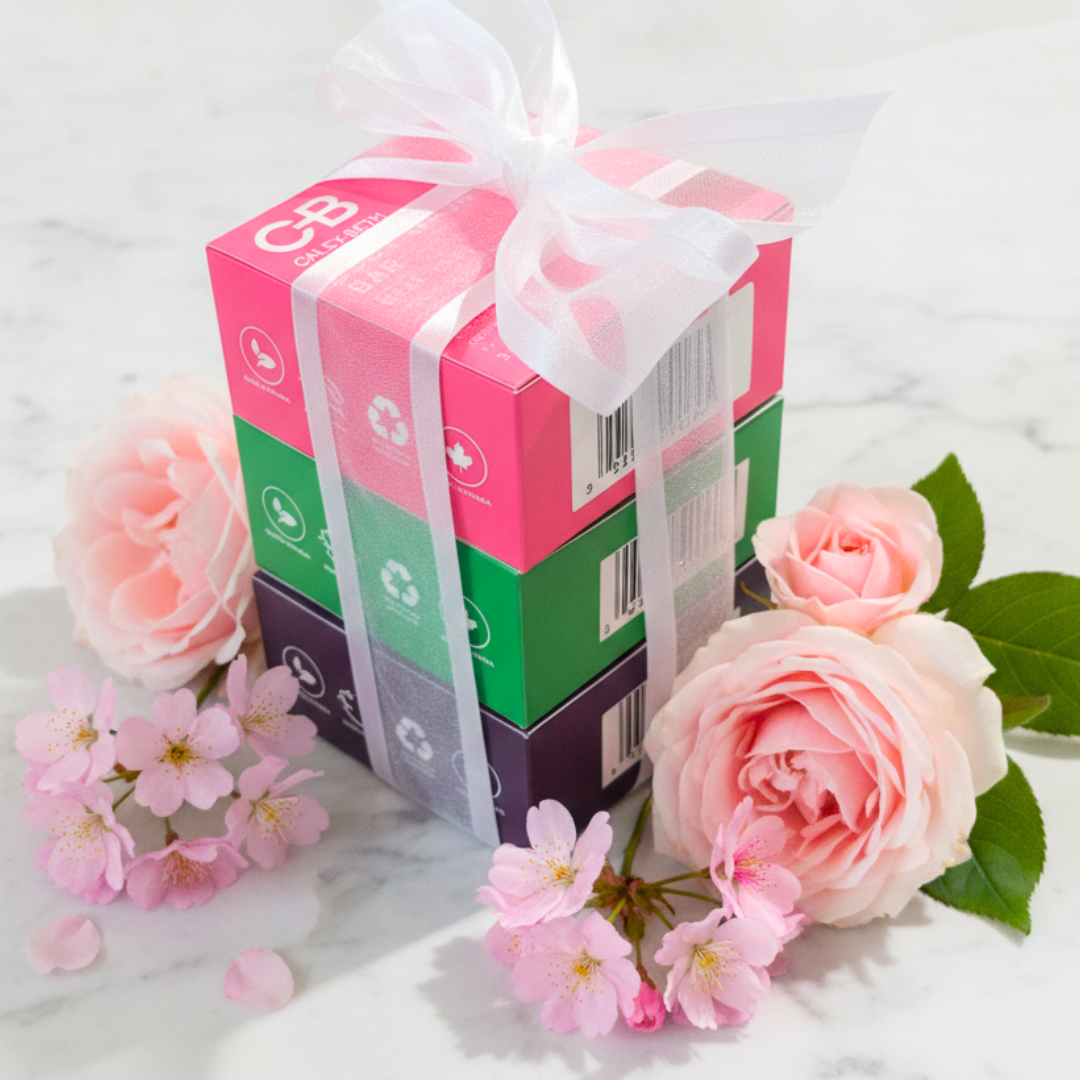 Gift-wrapped set of three Canadian-made Caley-Beth Body Wash Bars with a bow, featuring Pink Grapefruit & Palmarosa, Rosemary & Mint, and Lavender & Bergamot.